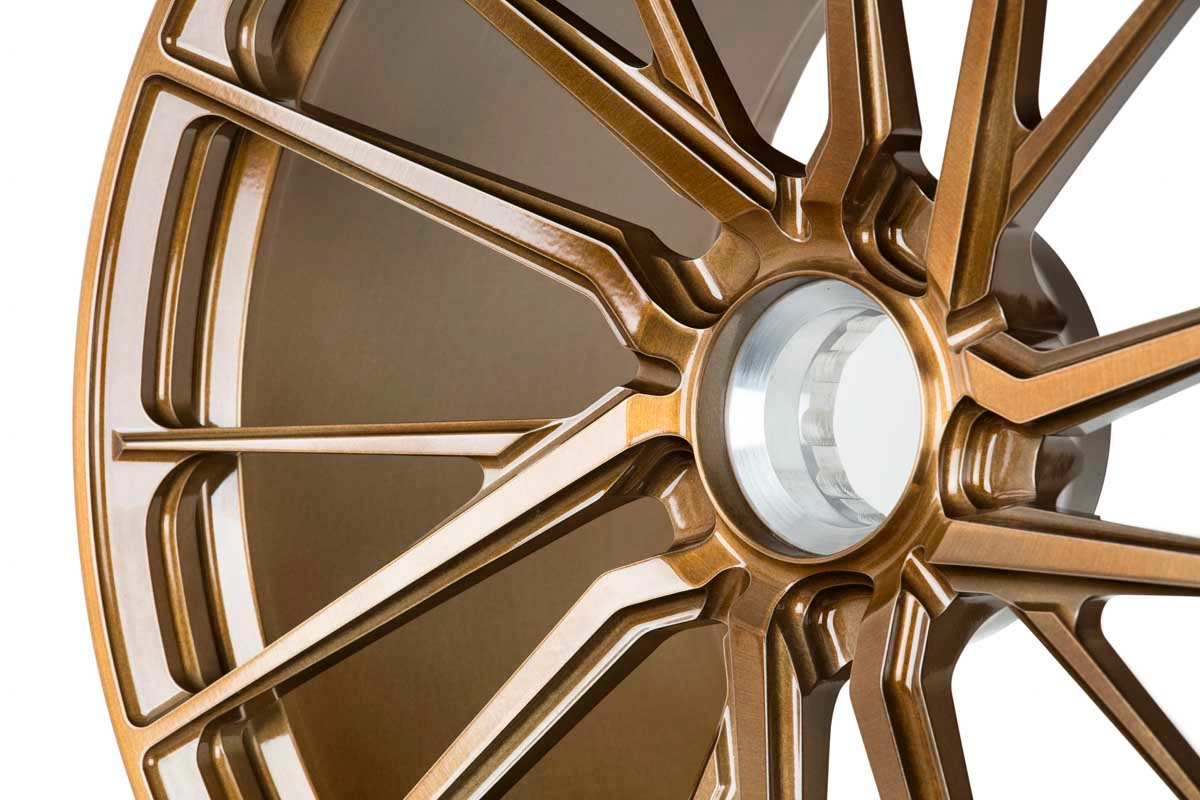 Vossen M-X4T face close-up showing spoke profile in Brickell Bronze